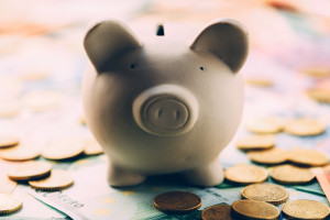 Piggy moneybox with euro cash and coins closeup. Financial concept